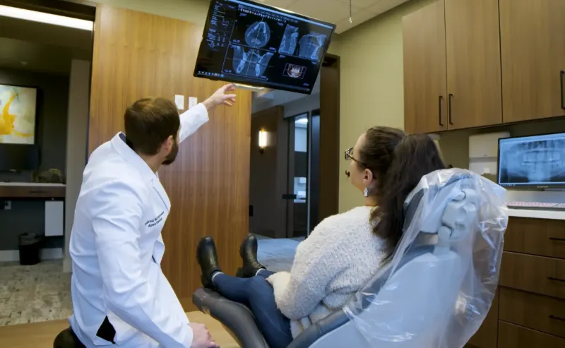 Dentist explaining X-rays to a patient